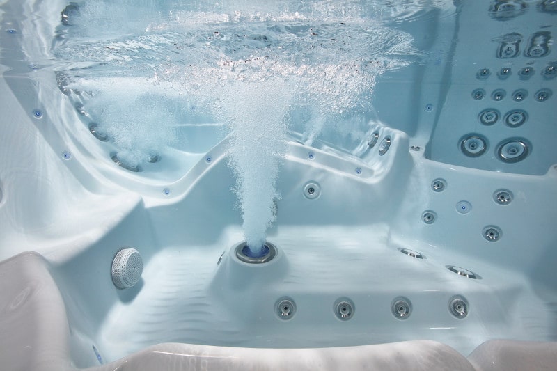 Close-up of hot tub jets and water